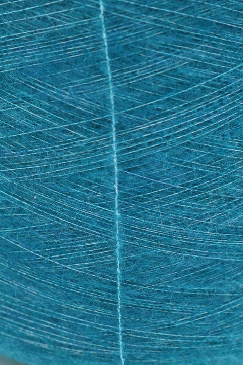 Sonja fylgiþráður 68% Alpakka 30% Polýester 2% Teygja 25 gr. 275 m. Nr. 21